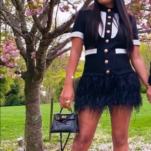 Black tweed dress or blazer with feathers